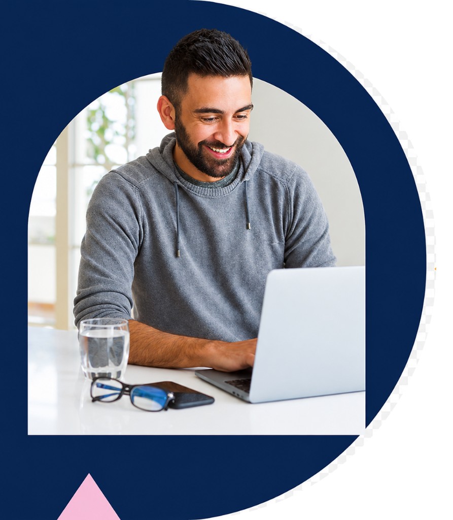 Smiling professional working on a laptop, framed by a modern navy blue graphic